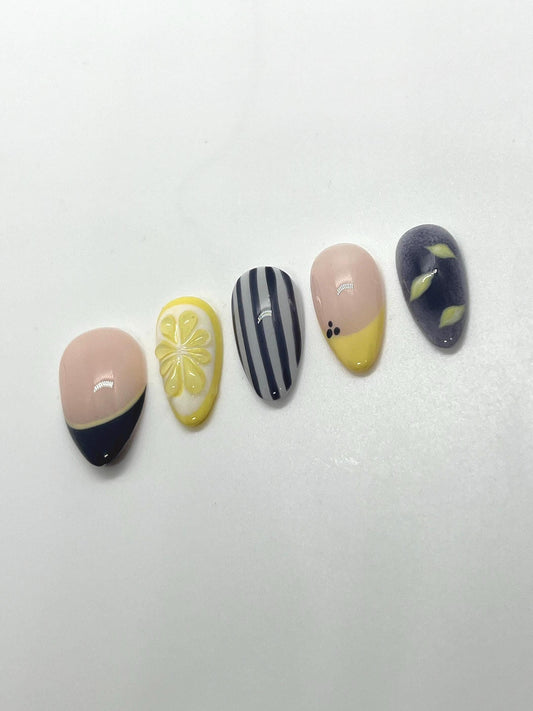 Handmade press-on nails with Blueberry Lemonade design on a white background