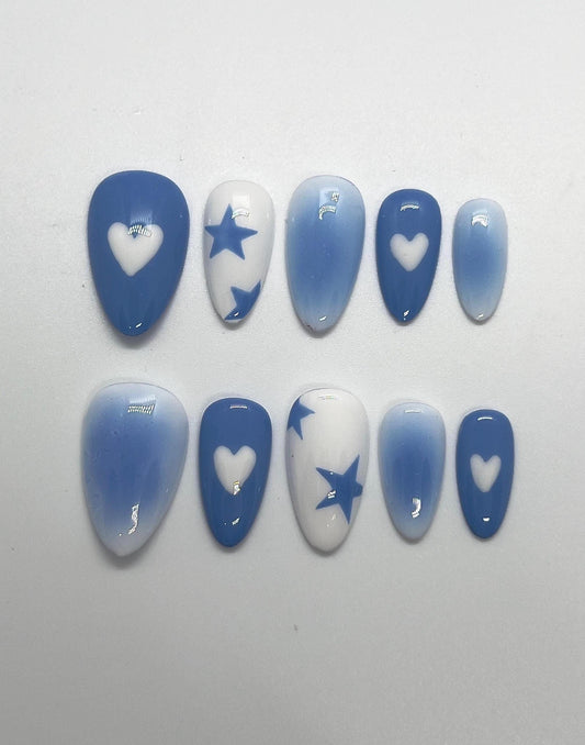 Step into a dreamy, futuristic glow with the Blue Lunar Chrome handmade press-on nail set, featuring soft lunar-blue gradients and reflective silver chrome details. This stunning design showcases abstract molten chrome patterns and delicate star accents that shimmer like moonlight, perfect for anyone who loves bold, celestial-inspired nails with a modern edge.