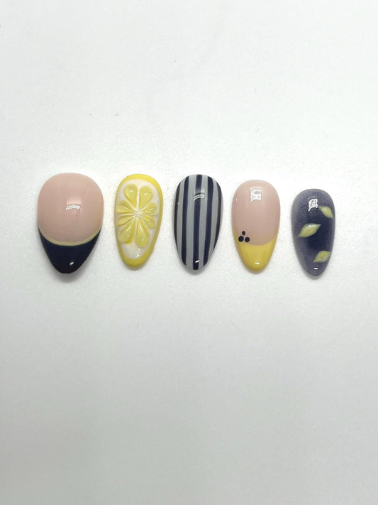 Handmade press-on nails with Blueberry Lemonade design on a white background