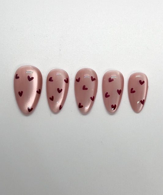Embrace the season of love with this handmade press-on nail set, featuring soft pinks, romantic reds, and delicate accents that capture the spirit of Valentine’s Day. Perfect for adding a touch of sweetness and elegance to any look—whether it’s a date night, celebration with friends, or simply treating yourself.