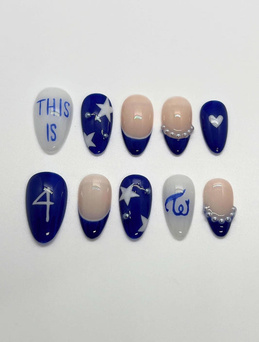 This TWICE-inspired handmade press-on nail set blends soft glam with playful charm, reflecting the group’s signature elegance and confidence. Featuring blue and beige tones with delicate details and polished finishes, these nails capture the essence of TWICE’s iconic stage presence.